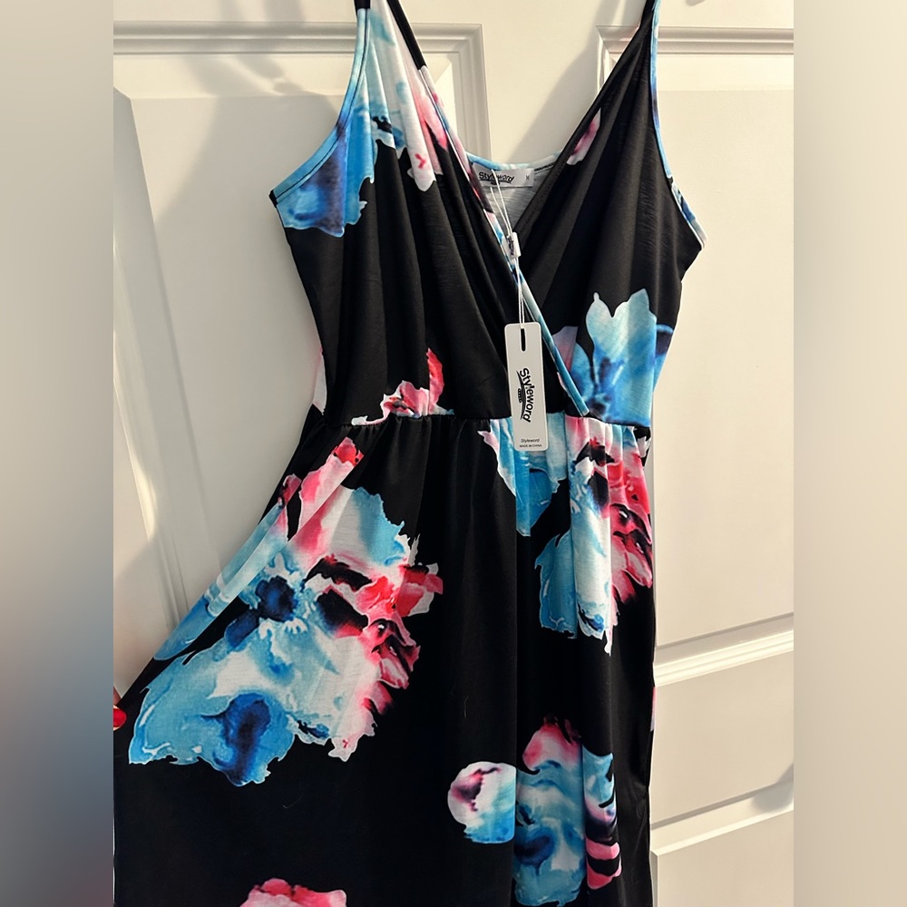 Cute dress with pockets. Brand new with tags medium